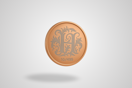 A photo of a laser-engraved copper coin