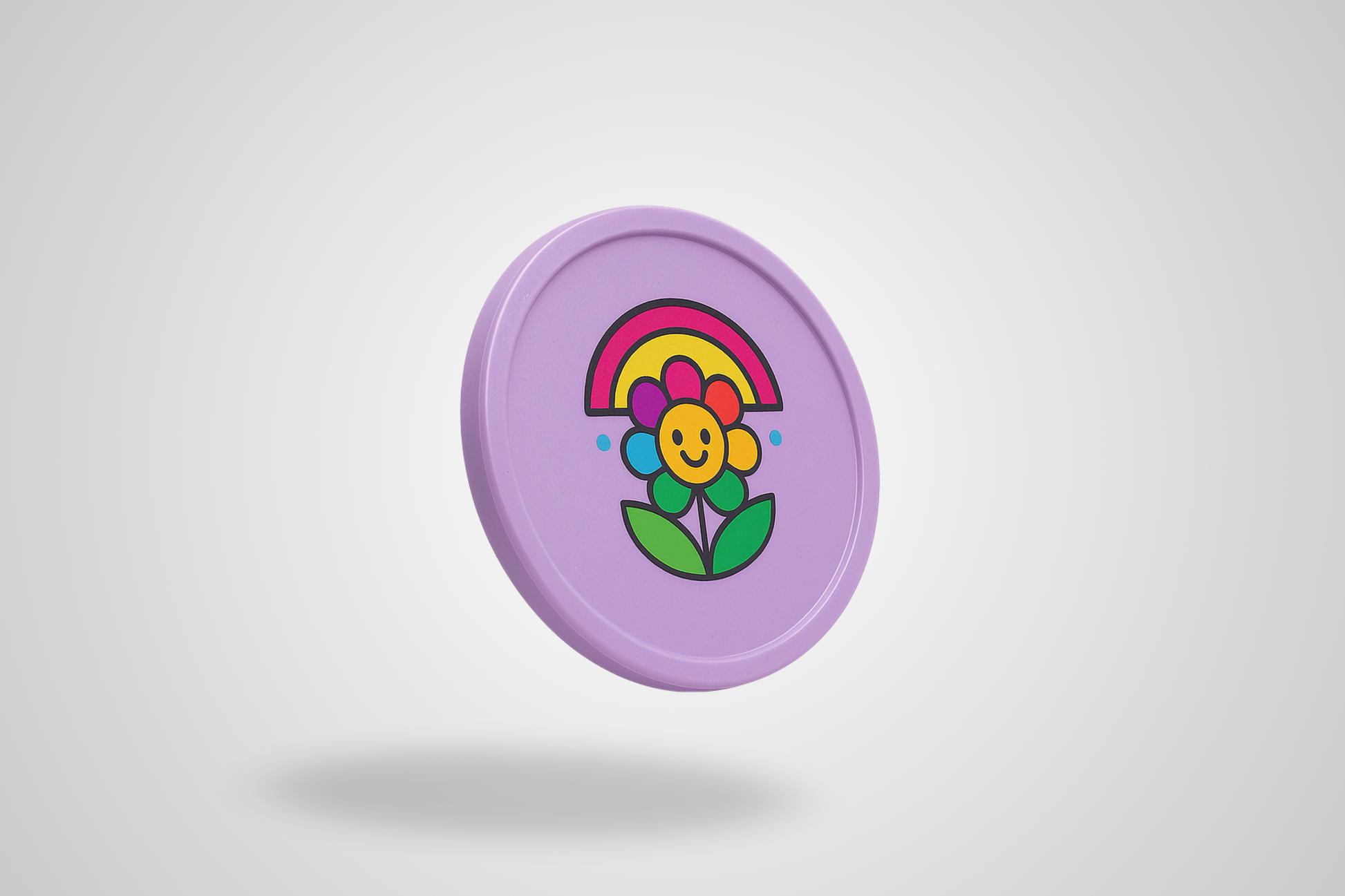 A photo of a pink plastic token with color print