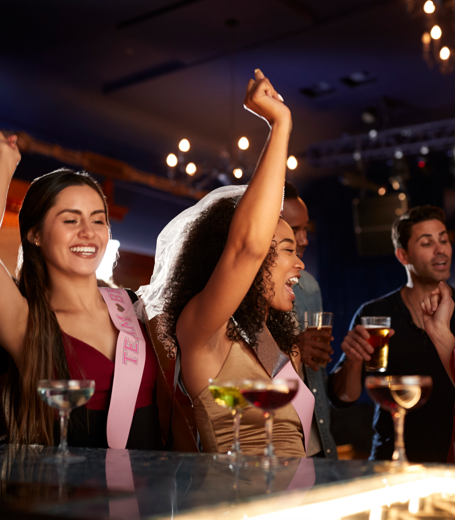 group of dancing female friends