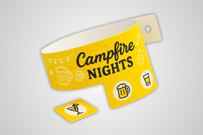A photo of a yellow entry wristband with detachable tickets
