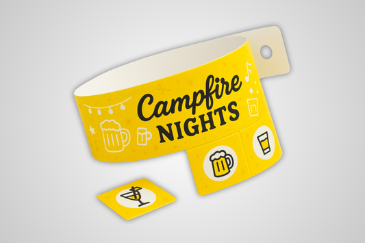 A photo of a yellow entry wristband with detachable tickets