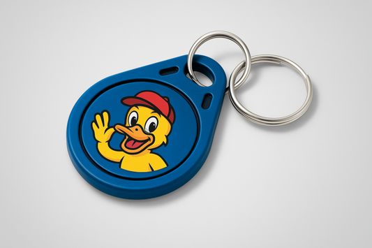 A photo of a blue key fob with colorful print