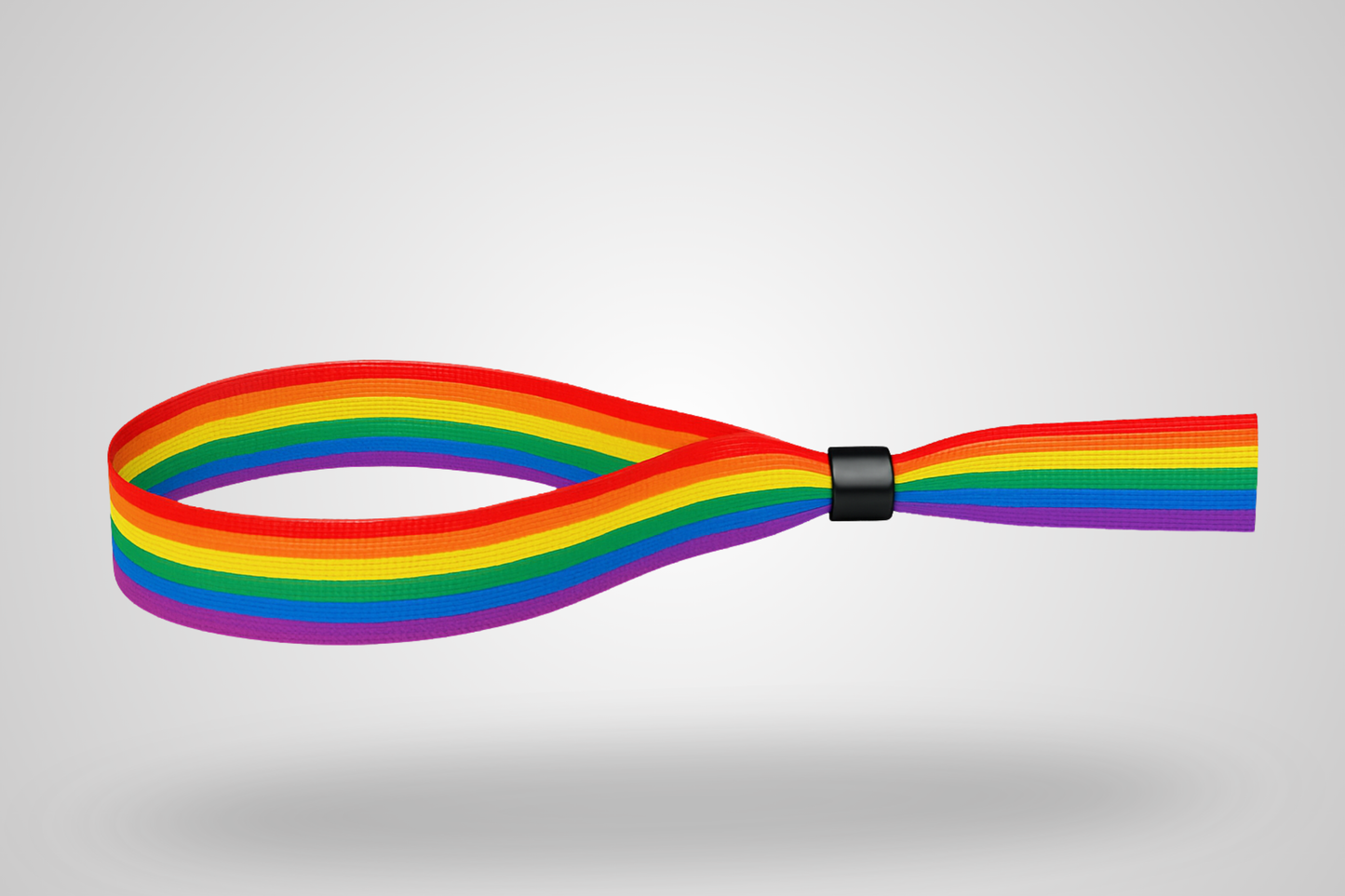 A photo of a fabric wristband with pride rainbow color pattern