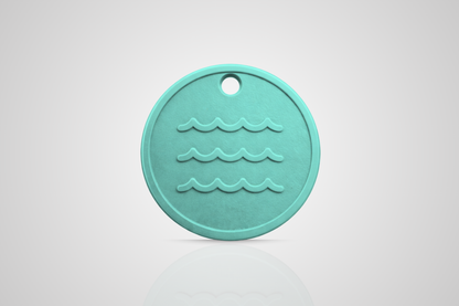 Ocean plastic token in turquoise with a motif of waves from JMband®