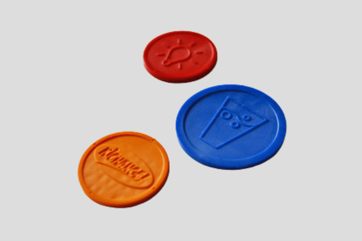 Upcycled Tokens Embossed with Logo