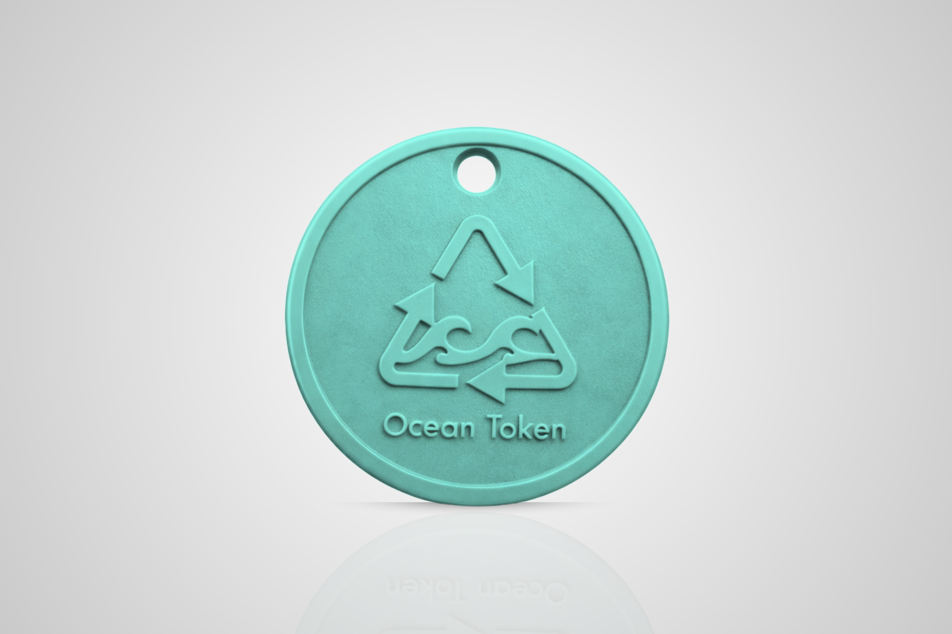 Ocean plastic token in turquoise with a motif of a recycle symbol with waves and the text "Ocean token" from JMband®