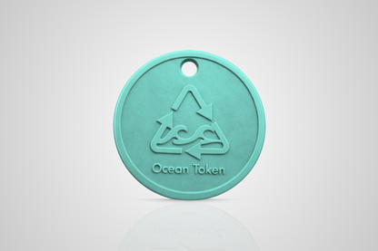 Ocean plastic token in turquoise with a motif of a recycle symbol with waves and the text "Ocean token" from JMband®