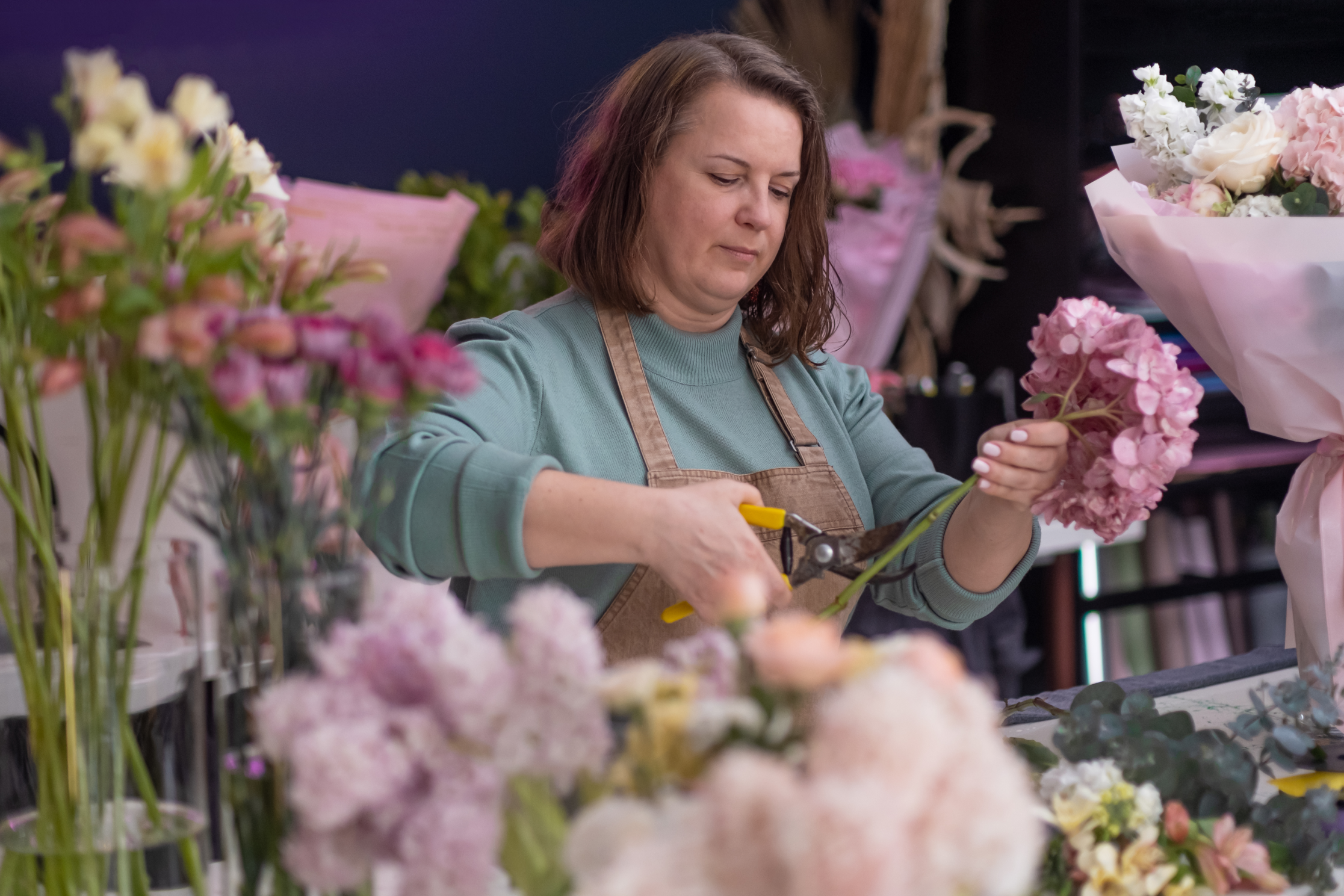 talented female florist business owner creates
