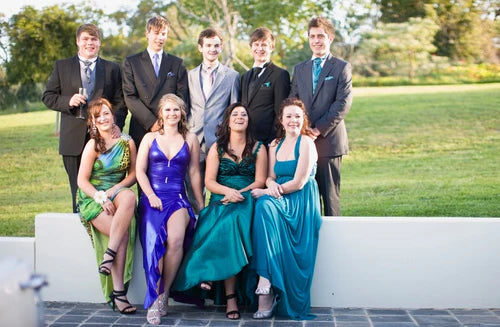 teenagers in formal wear posing together